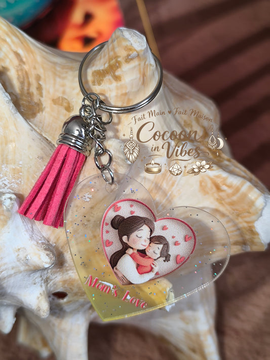 Porte-clé cœur transparent “Fête des Mères – Mom’s Love – Lien Précieux” – Maman & enfant enlacés – Franges suédine assorties – Modèle unique