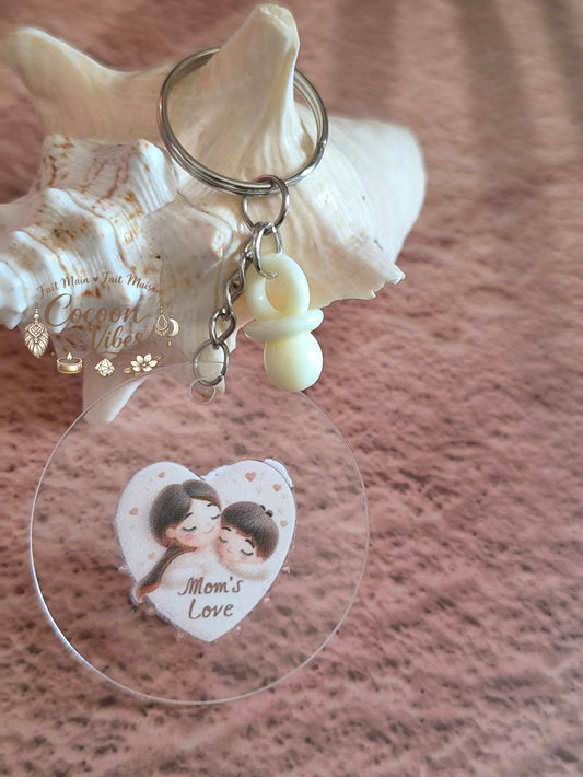 Porte-clé rond transparent “Fête des Mères – Série Mom's Love – Illustration Maman & Enfant” – Pendentif Tétine blanc crème – Création fait main et modèle unique