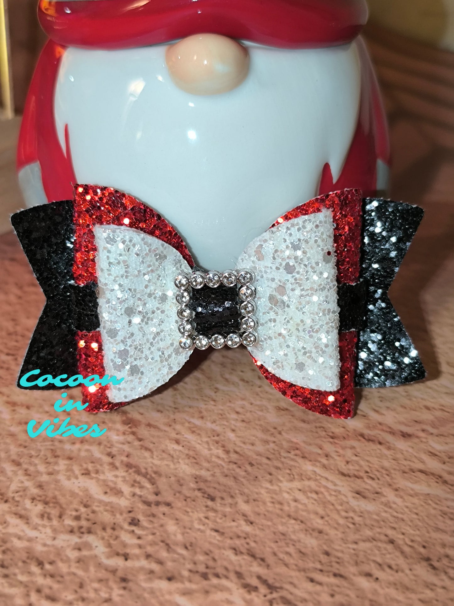 La Pince “Ceinture du Père Noël” – L’accessoire magique du Réveillon !